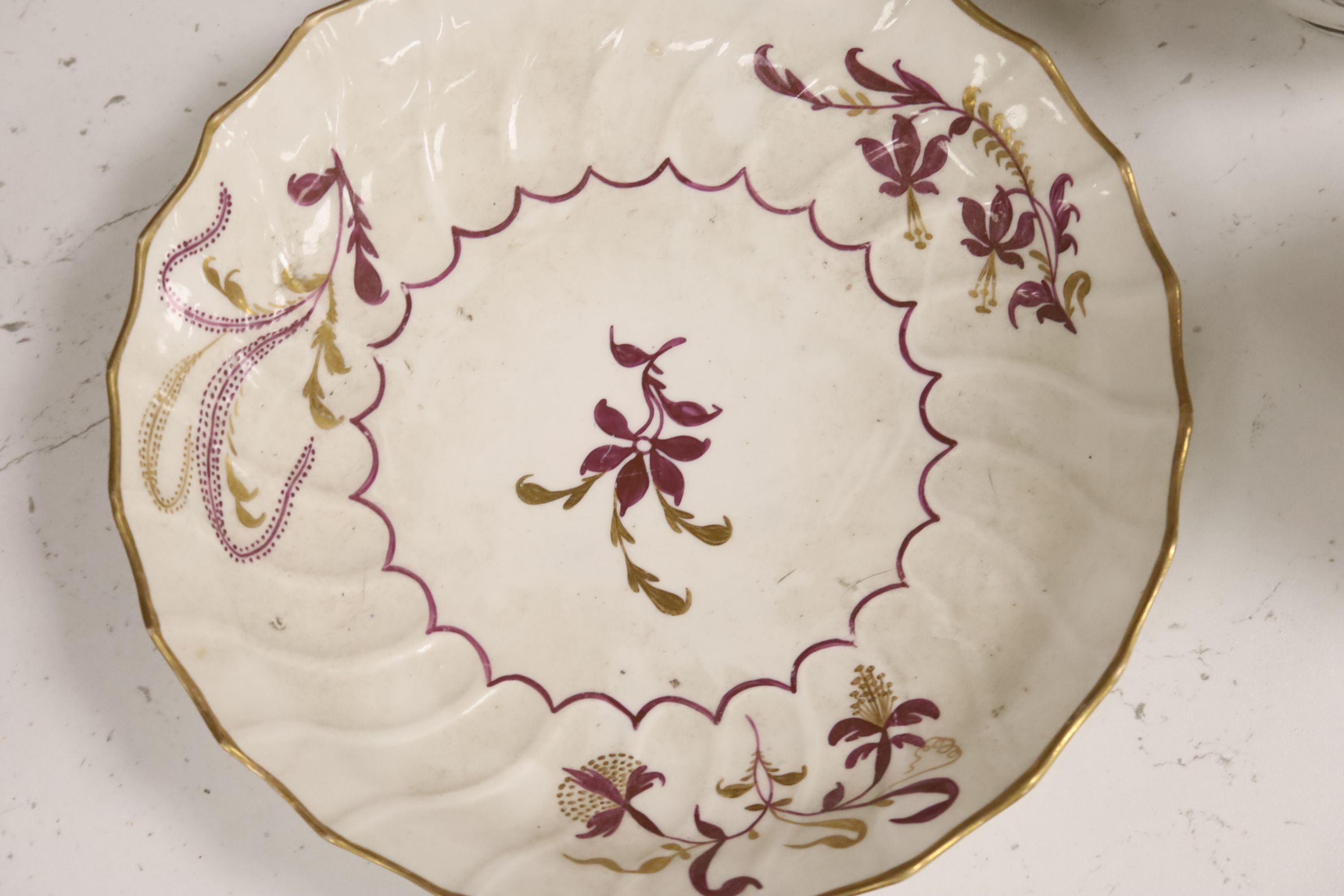 A group of late 18th / early 19th century English porcelain teaware and plates